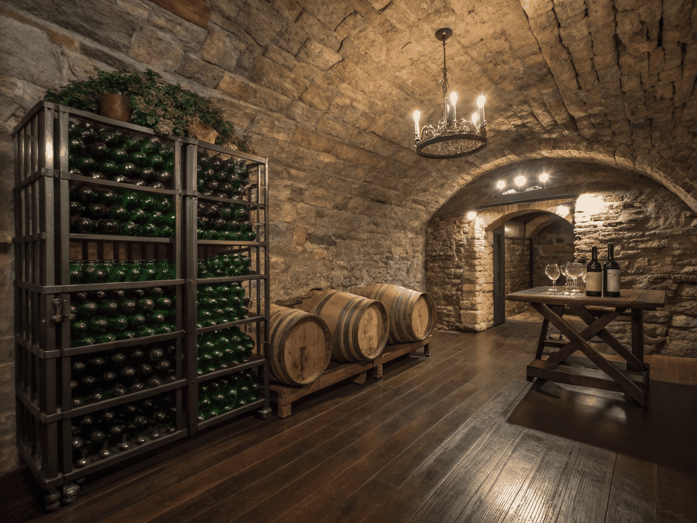 Rows of vintage wine bottles in a rustic stone cellar